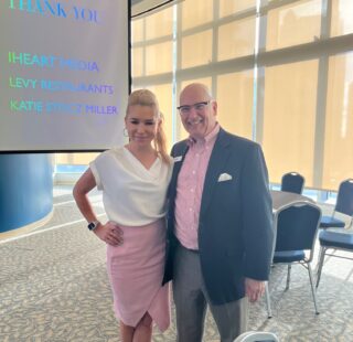 Ed Gilbert, Board Chair and Allison Walker from Channel 13 and the Emcee share a moment at The Making Waves Breakfast March 17 at Amway Center