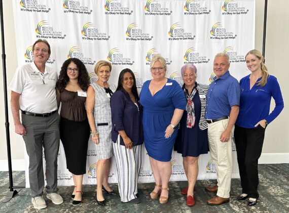 Gary, Izabella, MaryAnne, Nancy, Jill, Della, Jon, and Shannon at the MHACF Luncheon