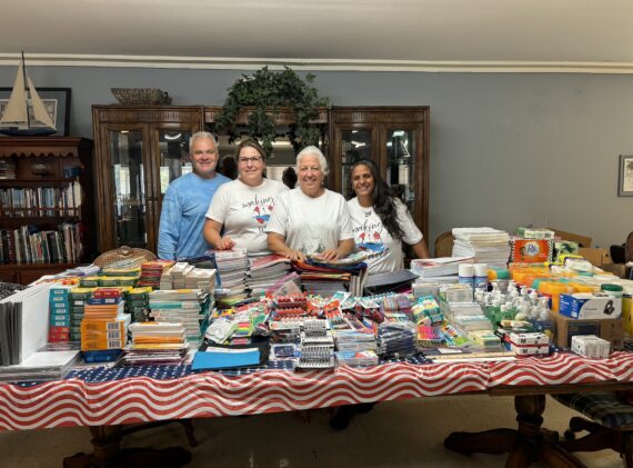 The Lifeboat Project staff with back to school donations